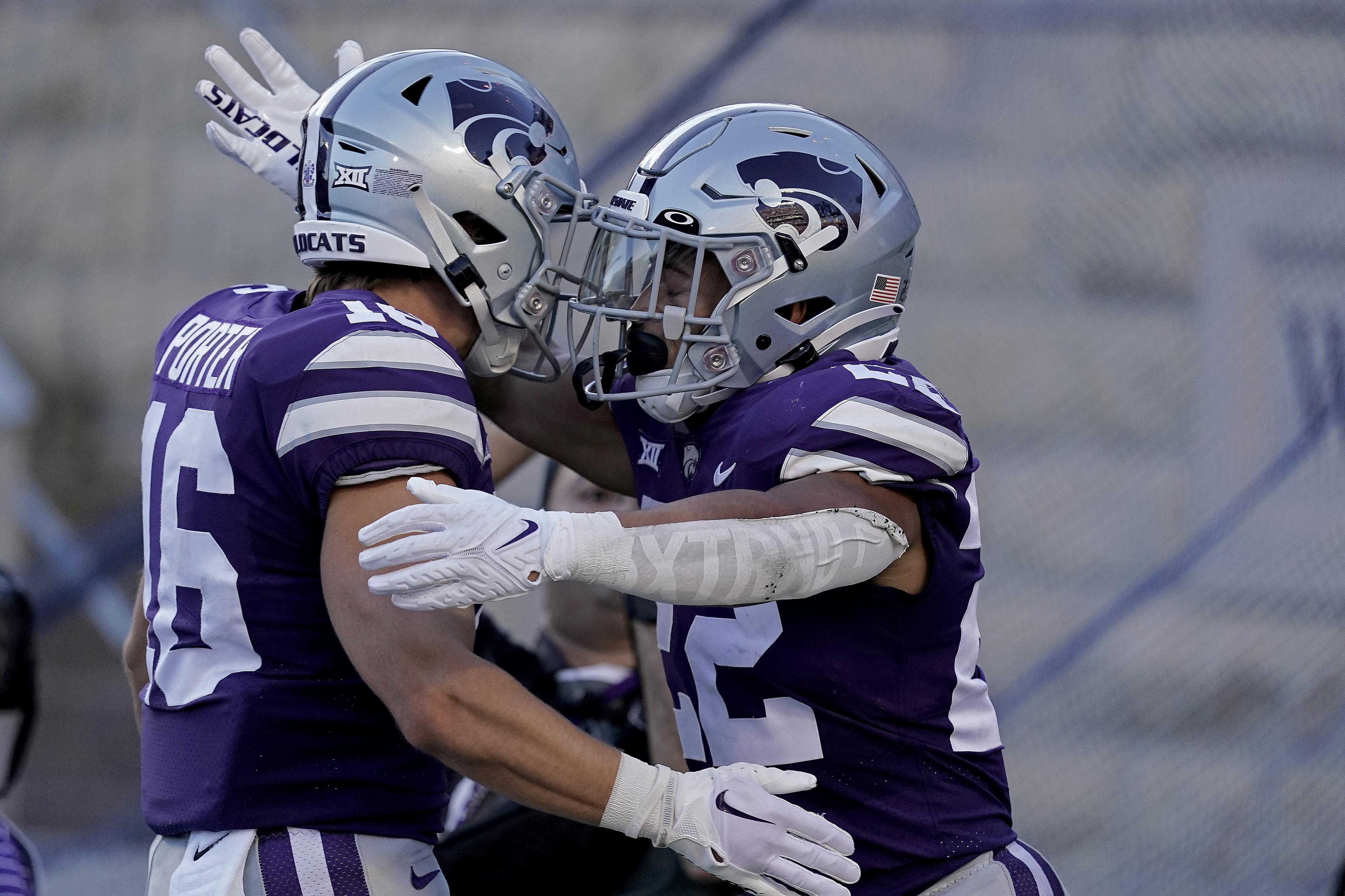 <p>Kansas State running back Deuce Vaughn, right, celebrates with Kansas State wide receiver Seth Porter after scoring a touchdown during the first half of an NCAA college football game against South Dakota Saturday, Sept. 3, 2022, in Manhattan, Kan. (AP Photo/Charlie Riedel)</p>
